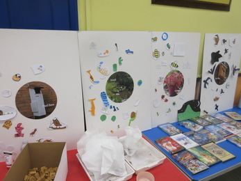 A series of stalls set up at a school fair, featuring pictures of different animals