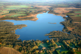 An aerial photo of a large body of water surrounded by vegetation
