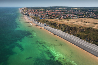 An aerial photo of Sheringham coast on a sunny day.