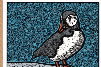 Lino-cut print of a puffin on sea-shore background