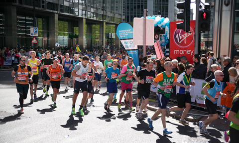 Runners on a sunday day in Canary Wharf as part of the London Marathon