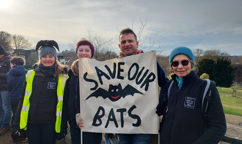 Members of NWT at a protest in Norwich with a sign that says 'save our bats'