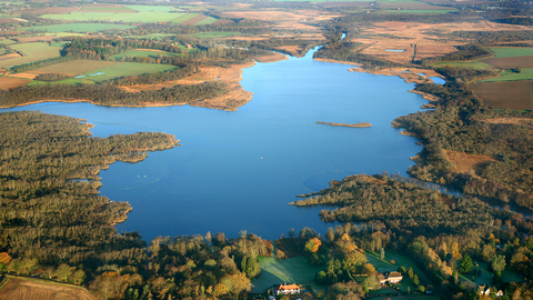 An aerial photo of a large body of water surrounded by vegetation