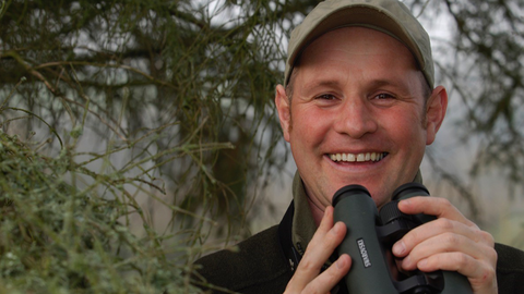 Mike Dilger with binoculars