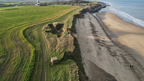 An aerial view of coastline erosion in North Norfolk