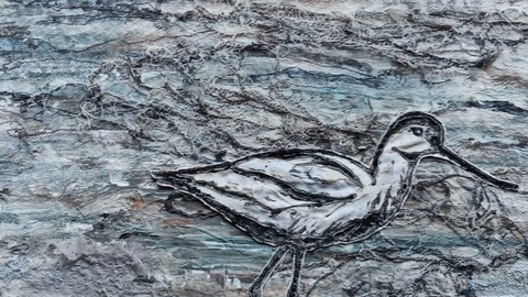 Textile image of an avocet on the shoreline