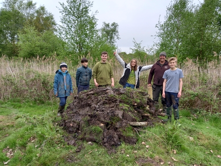 A group of young wilder wardens posing with their hibernaculum