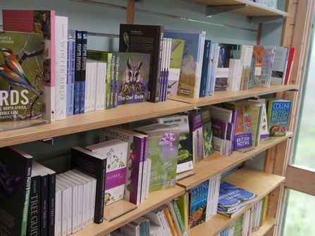 A shelf of books in the Weeting visitor centre gift shop