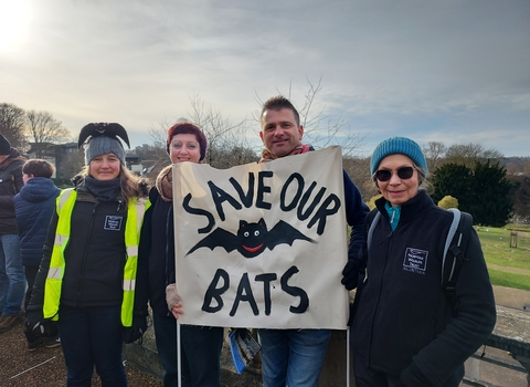 Members of NWT at a protest in Norwich with a sign that says 'save our bats'